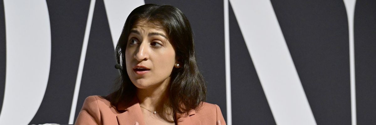 ​Then-Federal Trade Commission Chair Lina Khan in a pink suit sitting in a chair